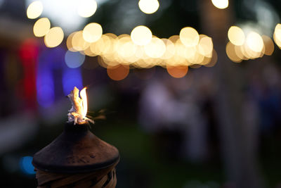 Close-up of illuminated christmas decorations at night