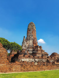 Low angle view of old temple against blue sky