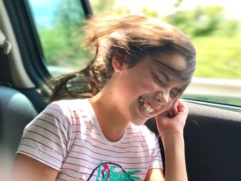 Close-up of girl in car