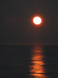 Scenic view of sea against clear sky during sunset