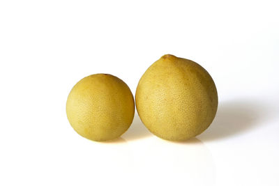 Close-up of eggs against white background