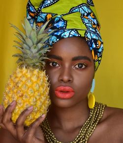 Close-up of woman holding pineapple