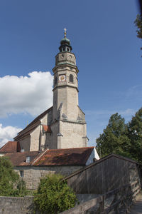 Low angle view of bell tower against sky