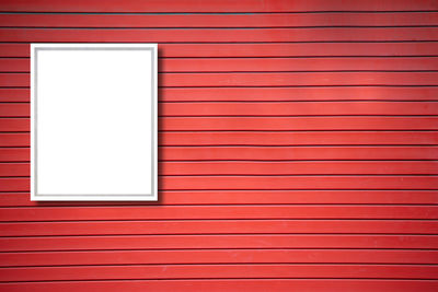 Full frame shot of window on red wall