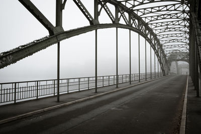 Bridge over road against sky