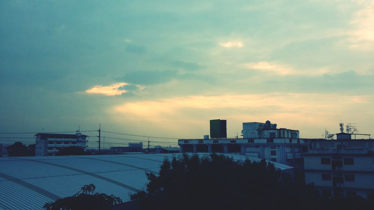 building exterior, architecture, built structure, sky, sunset, cloud - sky, silhouette, cloudy, cloud, house, tree, residential building, city, residential structure, building, nature, low angle view, outdoors, no people, dusk