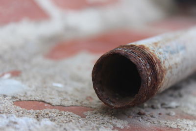 Close-up of rusty metal on table