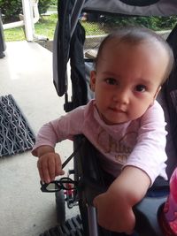 Portrait of cute baby girl in bus