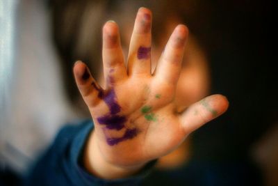 Cropped image of woman looking through window