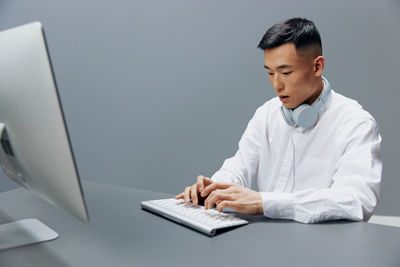 Young businesswoman working at table