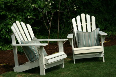 Empty chairs in yard