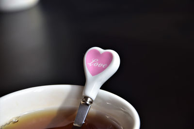 Close-up of heart shape over black background