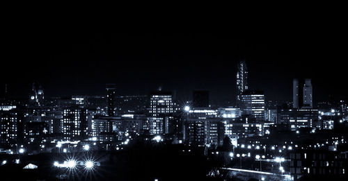 Illuminated cityscape at night