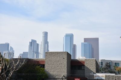 Modern buildings in city against sky