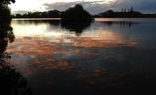 Scenic view of lake against sky during sunset