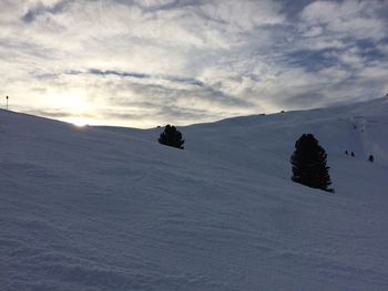 Scenic view of snow covered landscape against sky