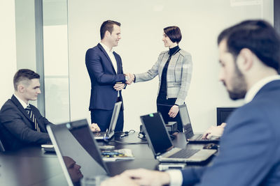 Business colleagues working in office