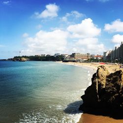 Panoramic view of sea against sky in city