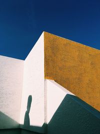 Low angle view of building against blue sky