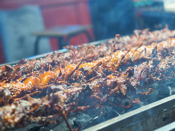 Close-up of meat on barbecue grill