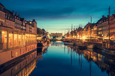 Beautiful view with traditional houses and old wooden ships along the nyhavn canal or new harbour
