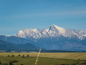 Scenic view of snowcapped mountains against sky