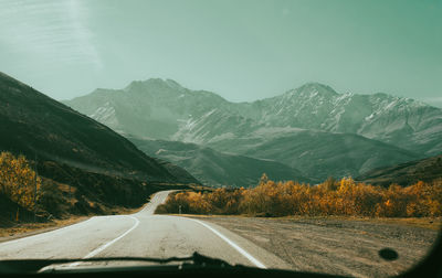 View of the road and mountains from the car window