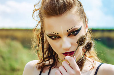 Close-up portrait of young woman with make-up