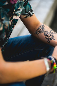 Close-up of woman hand with tattoo