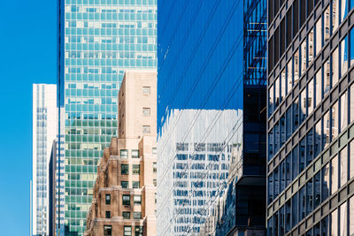 Low angle view of modern buildings in city