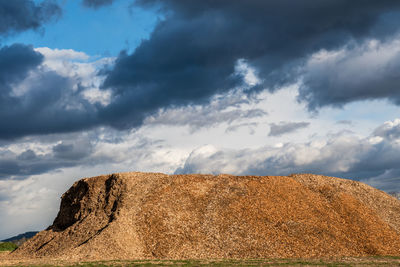 Low angle view of rock formations against sky