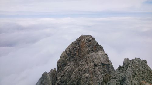 Low angle view of rock formations against sky