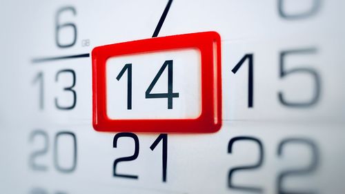 Close-up of information sign on wall