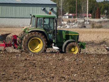 Tractor working on field