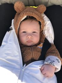 Portrait of cute baby boy sleeping on bed