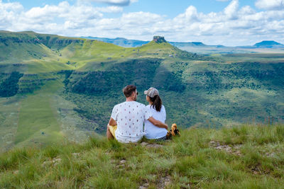 Rear view of couple looking at landscape