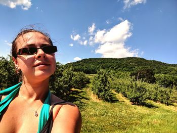 Portrait of man wearing sunglasses against sky