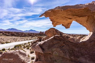 Rock formations on landscape against sky