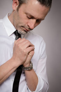 Close-up of young man against white background