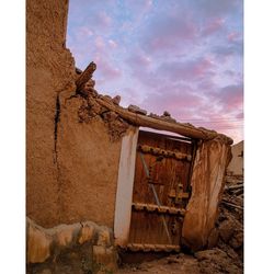 Old abandoned building against sky