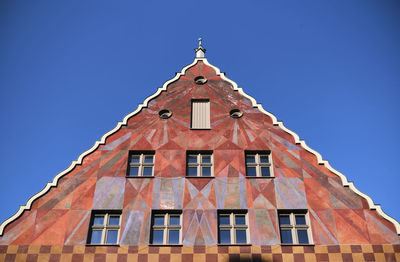 Low angle view of building against clear blue sky