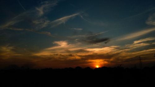 Low angle view of dramatic sky during sunset