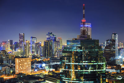 Illuminated buildings in city at night