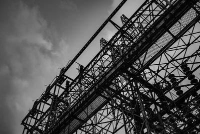 Low angle view of silhouette ferris wheel against sky