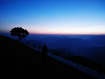 Scenic view of silhouette mountain against sky at sunset