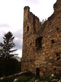 Low angle view of old building against sky