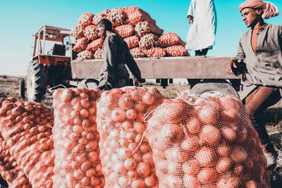 Group of people for sale at market stall