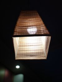 Low angle view of illuminated lamp at home