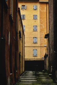 Narrow alley amidst buildings in city