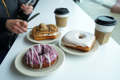 Close up assorted sweet donut served with hot coffee